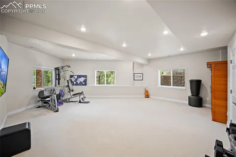 a view of a living room with furniture and a flat screen tv