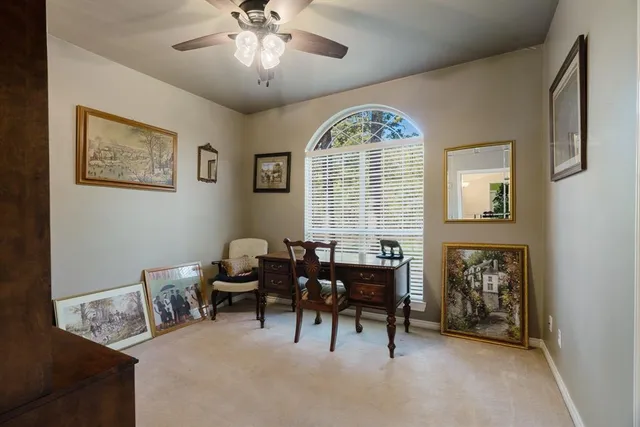 a view of a livingroom with furniture and a window