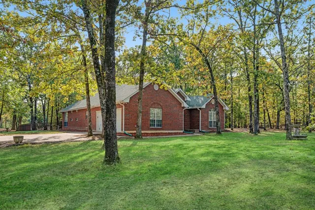 a view of a yard with a tree