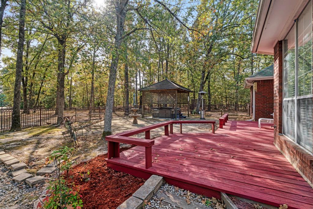 700 Hidden Lake Drive Powderly, TX 75473 - Photo 18 of 32 a view of a backyard with sitting area