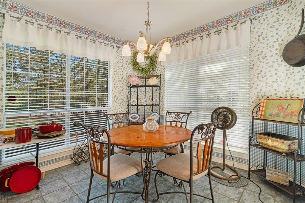 700 Hidden Lake Drive Powderly, TX 75473 - Photo 4 of 32 a backyard of a house with table and chairs