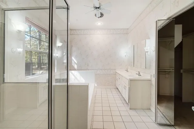 a bathroom with a shower and a sink