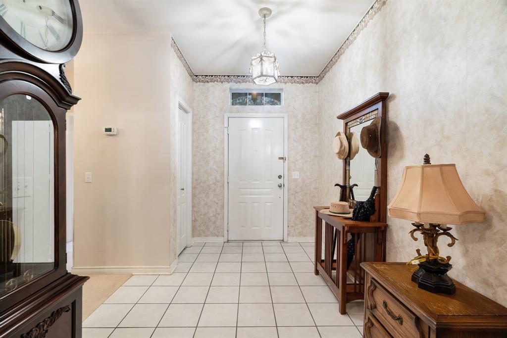 700 Hidden Lake Drive Powderly, TX 75473 - Photo 9 of 32 a view of a hallway with washer and dryer