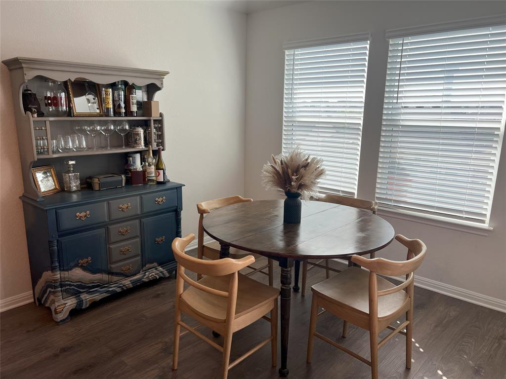 248 Lone Cedar Road Marble Falls, TX 78654 - Photo 17 of 32 a dining room with furniture and wooden floor