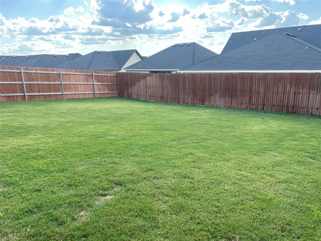 248 Lone Cedar Road Marble Falls, TX 78654 - Photo 28 of 32 a view of a backyard with a cabin
