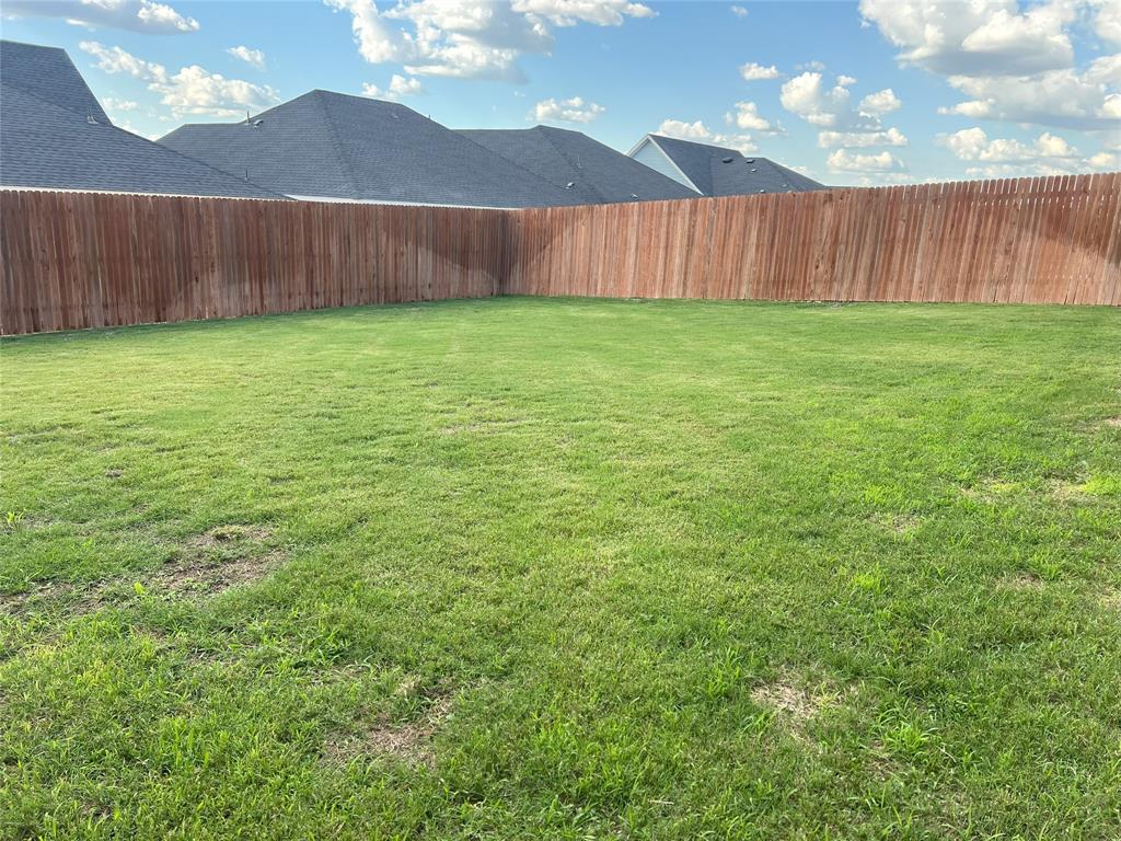 248 Lone Cedar Road Marble Falls, TX 78654 - Photo 29 of 32 a view of a backyard with a fence