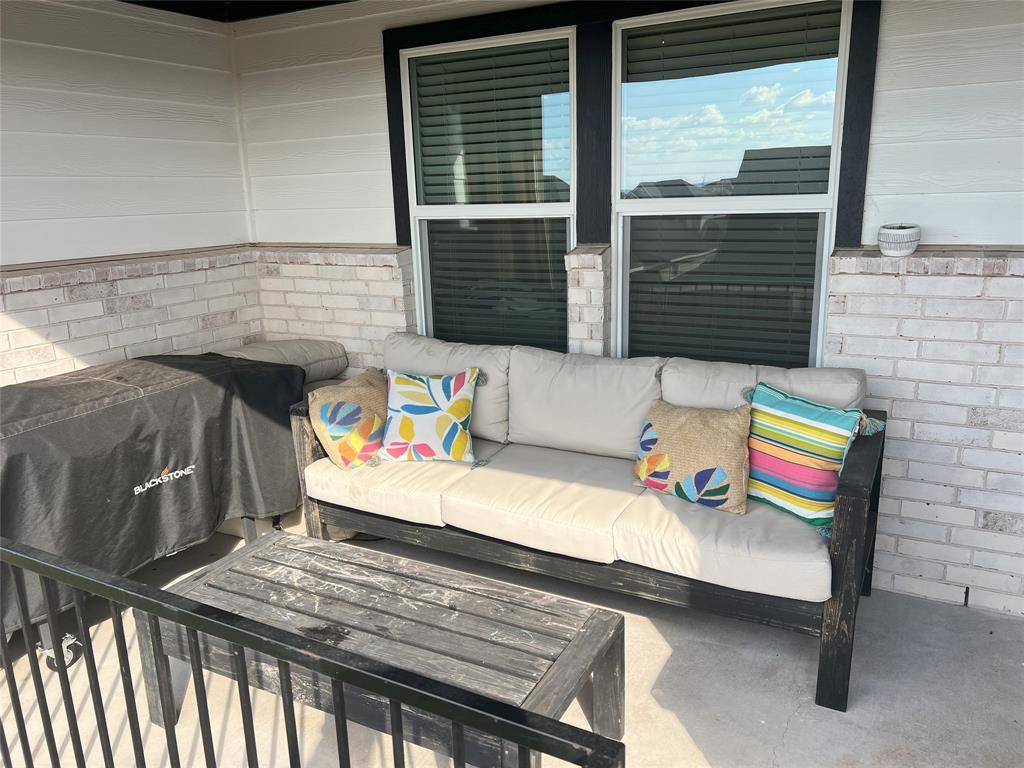 248 Lone Cedar Road Marble Falls, TX 78654 - Photo 31 of 32 a view of table and chairs in patio