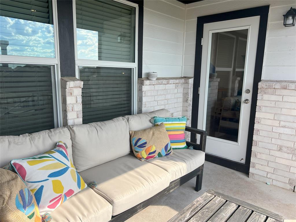 248 Lone Cedar Road Marble Falls, TX 78654 - Photo 32 of 32 a balcony with furniture and a potted plant