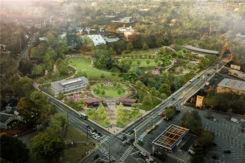 an aerial view of residential houses with outdoor space