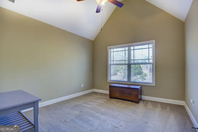 a bedroom with a bed and a piano
