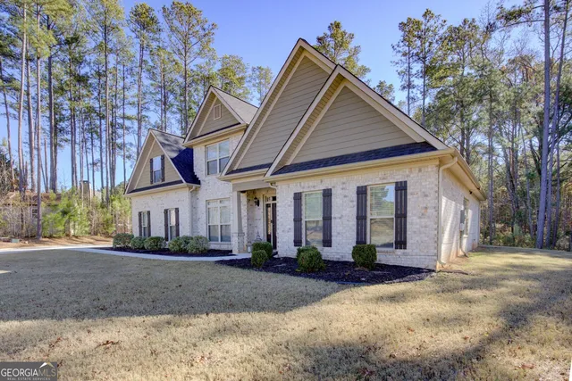 a view of a white house with a outdoor space