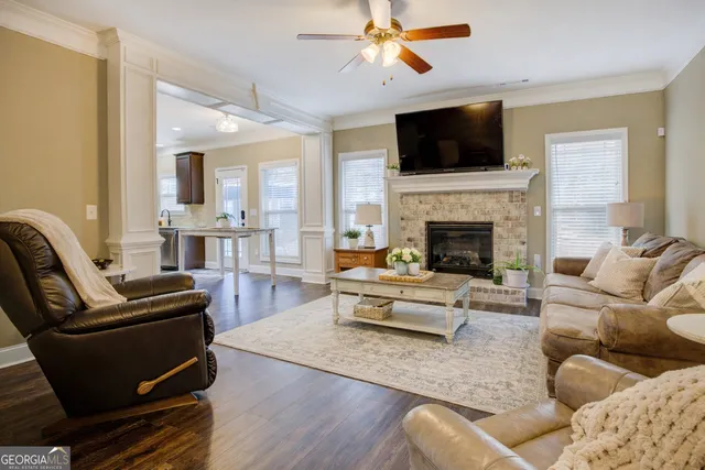 a living room with furniture fireplace and a flat screen tv