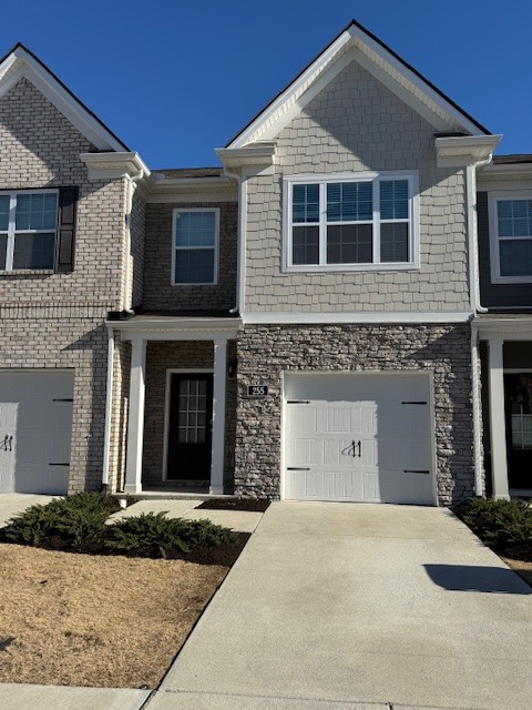 255 Hazel Lane Lebanon, TN 37087 - Photo 1 of 12 a front view of a house with a yard and garage