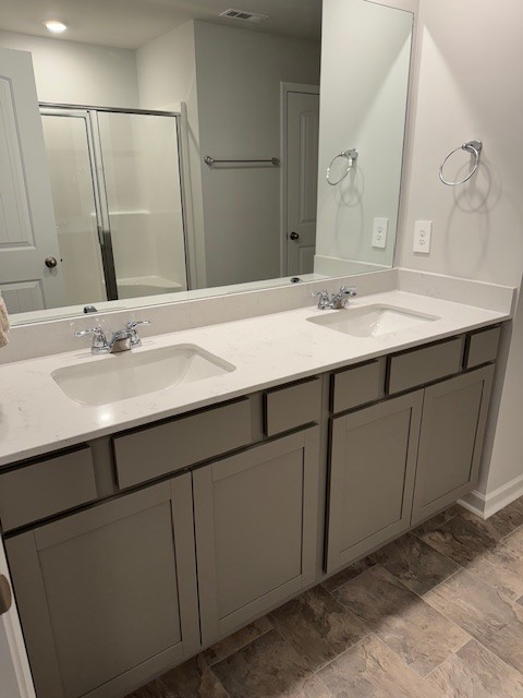 255 Hazel Lane Lebanon, TN 37087 - Photo 7 of 12 a bathroom with a double vanity sink and a mirror