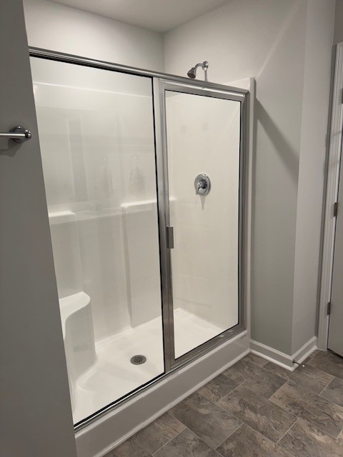 255 Hazel Lane Lebanon, TN 37087 - Photo 8 of 12 a bathroom with a glass shower door