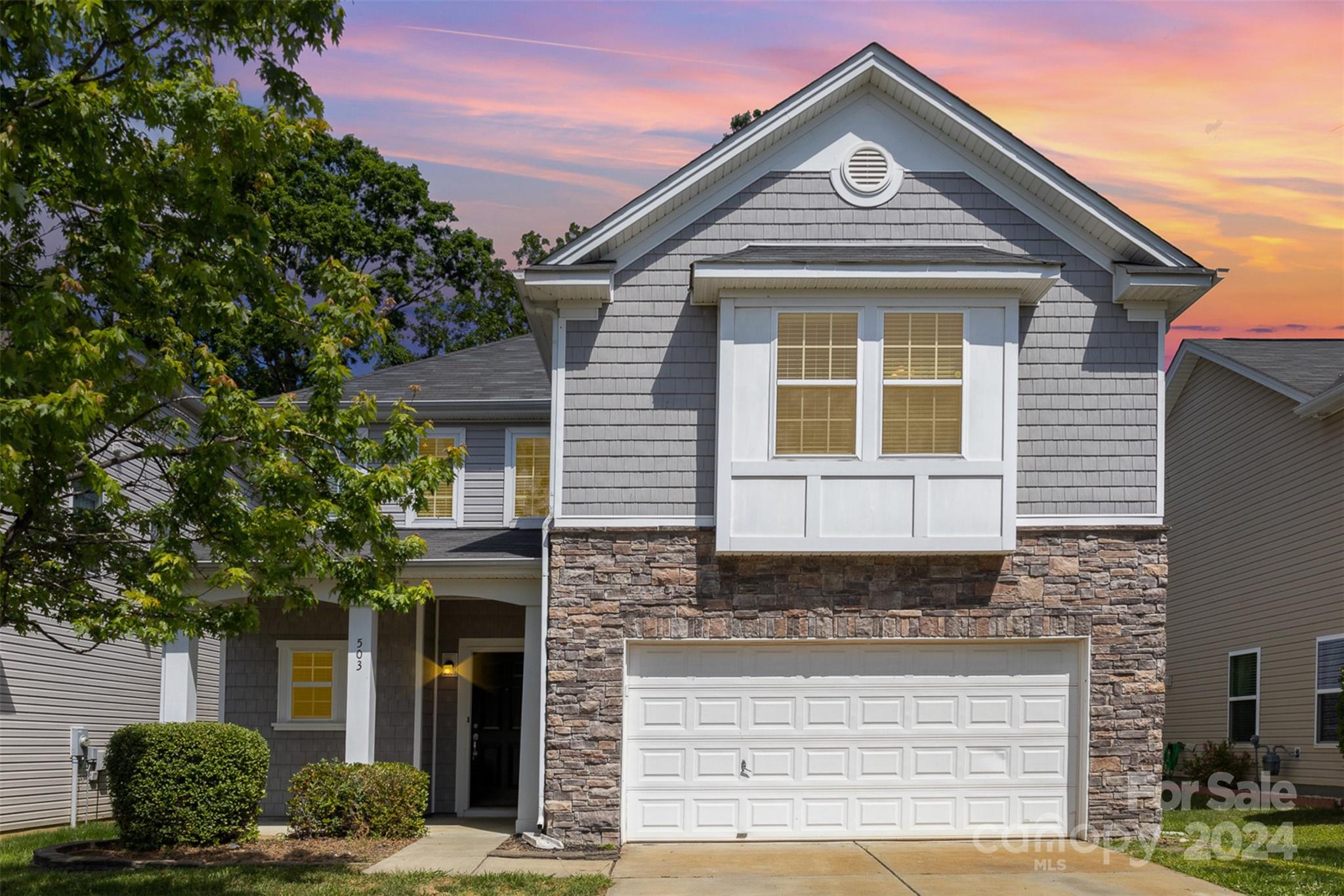 503 Waterlemon Way Monroe, NC 28110 - Photo 1 of 22 a front view of a house with garden