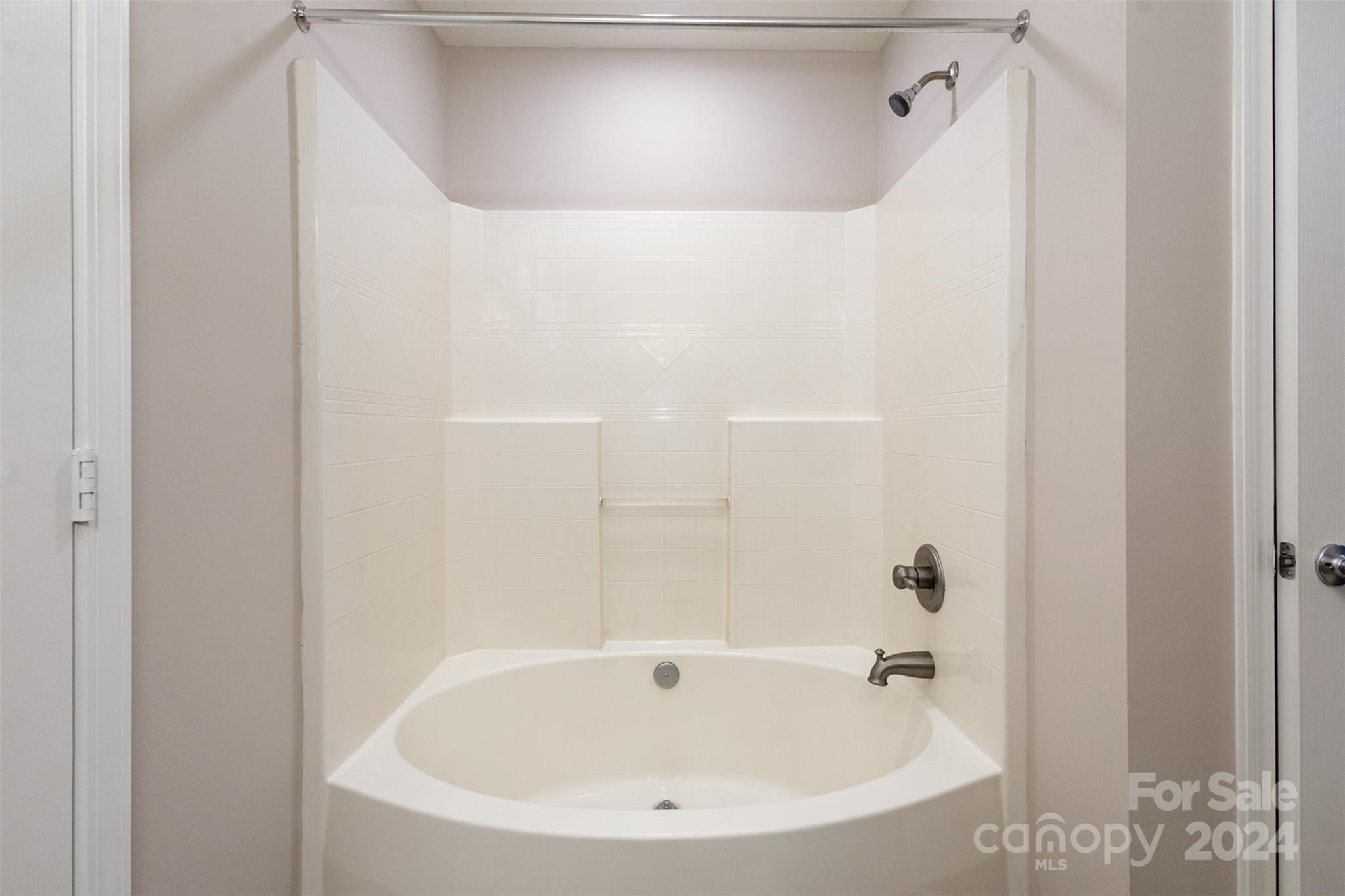 503 Waterlemon Way Monroe, NC 28110 - Photo 11 of 22 a bathroom with a white bath tub