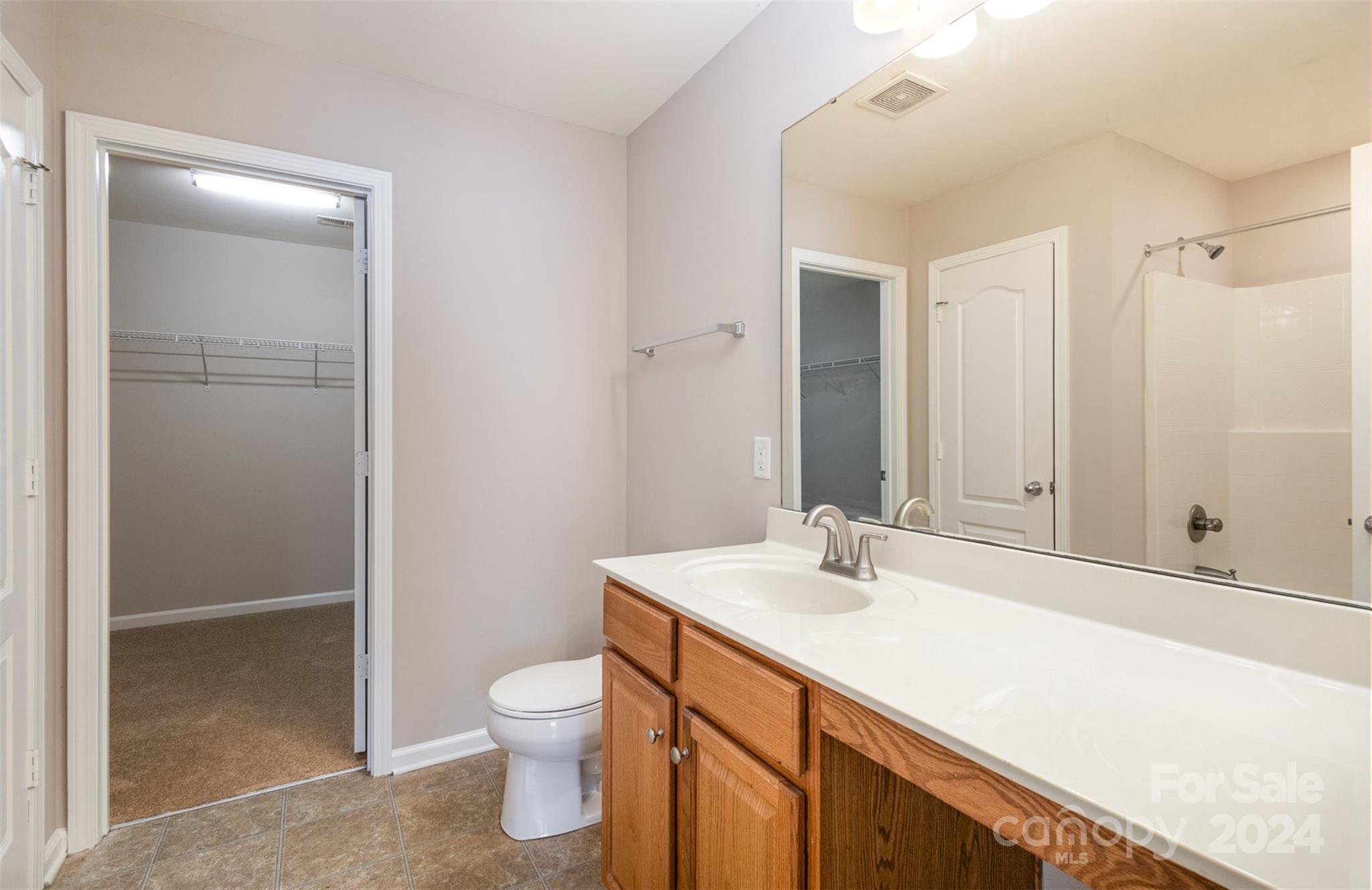 503 Waterlemon Way Monroe, NC 28110 - Photo 12 of 22 a bathroom with a sink a toilet and shower