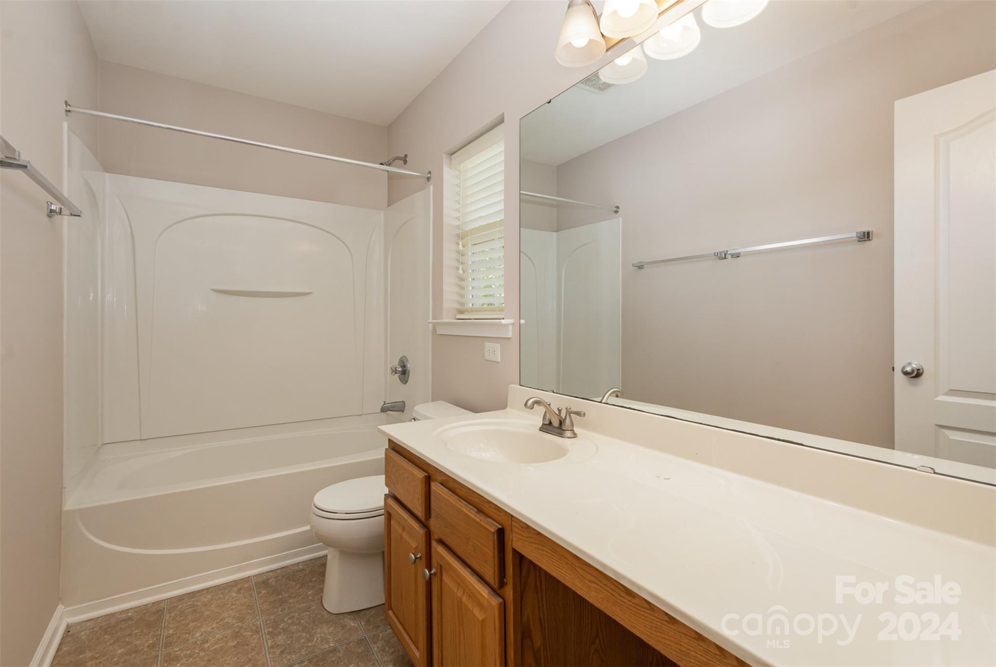 503 Waterlemon Way Monroe, NC 28110 - Photo 15 of 22 a bathroom with a sink a toilet and shower
