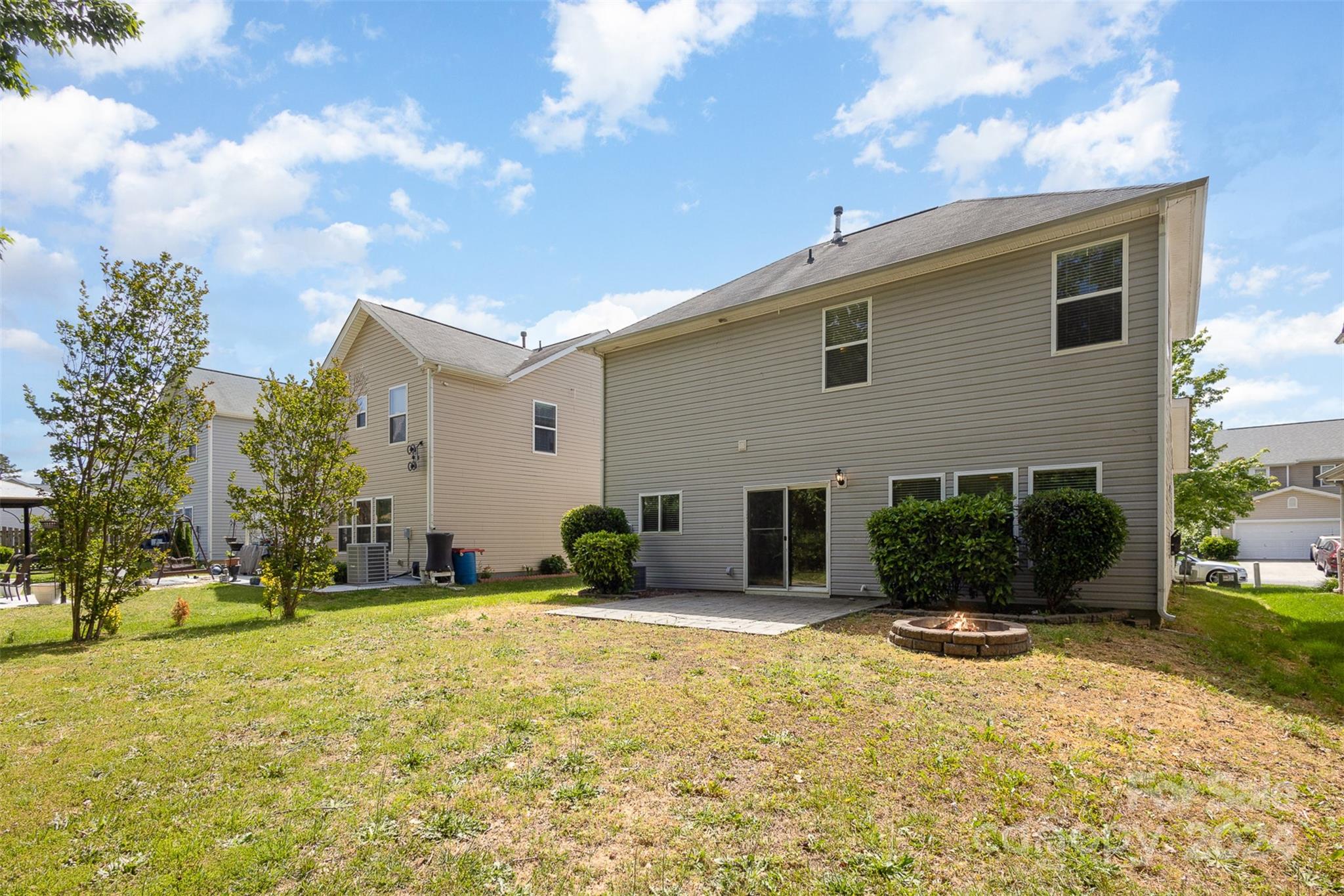 503 Waterlemon Way Monroe, NC 28110 - Photo 20 of 22 a backyard of a house with yard and outdoor seating