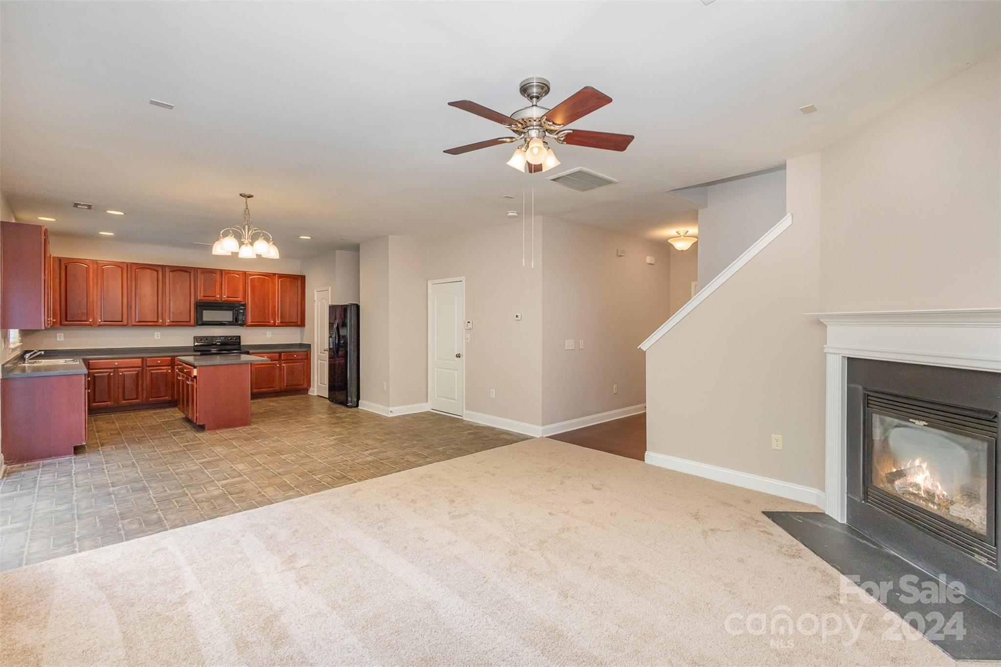 503 Waterlemon Way Monroe, NC 28110 - Photo 4 of 22 a view of a kitchen with a sink and a fireplace