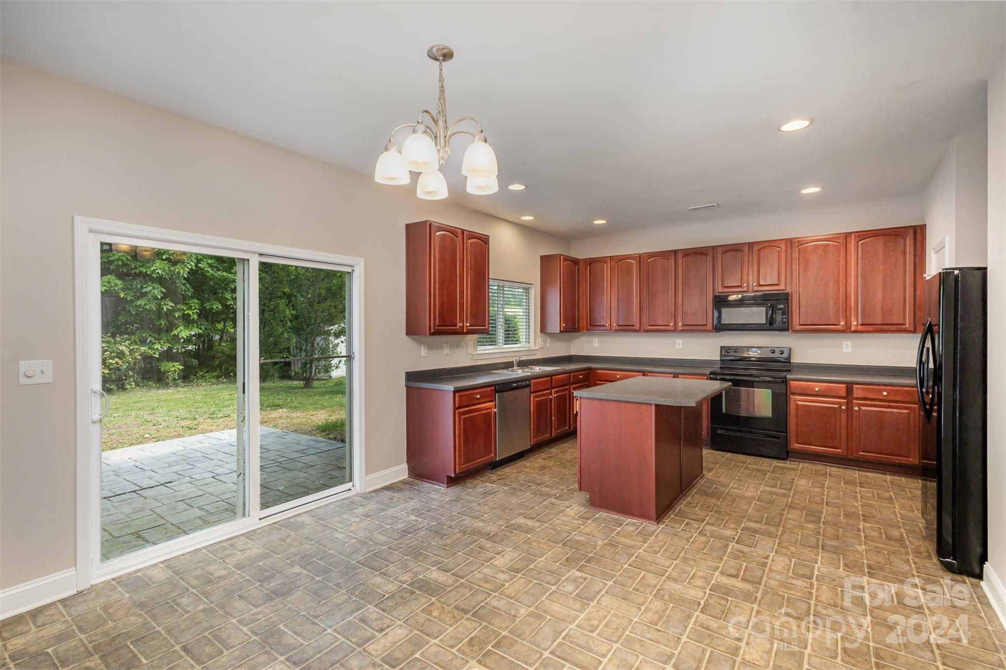 503 Waterlemon Way Monroe, NC 28110 - Photo 6 of 22 a large kitchen with a large counter top stainless steel appliances and cabinets