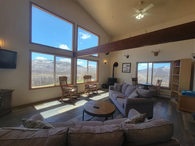a view of a two chairs in the patio