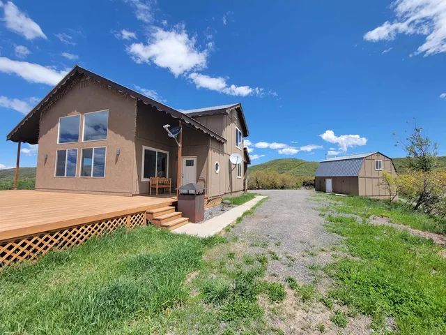 a front view of a house with a yard and porch