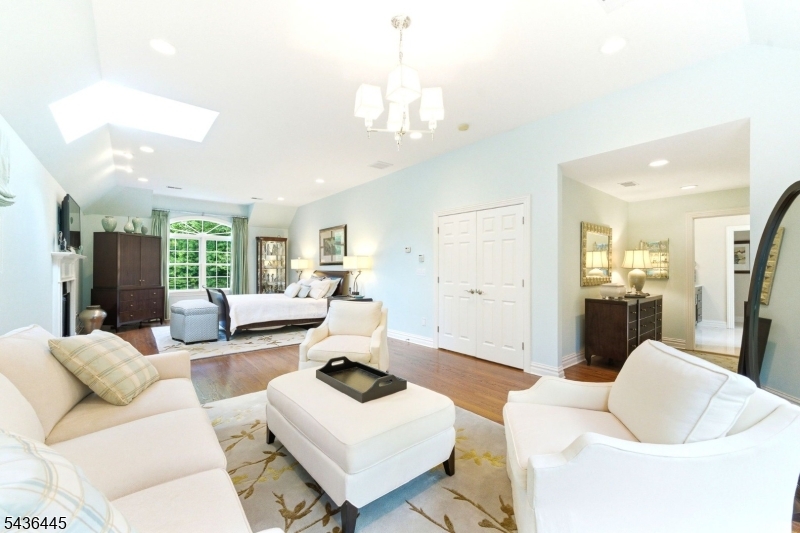 4 Windemere Way Sparta, NJ 07871 - Photo 21 of 50 a living room with furniture and a chandelier