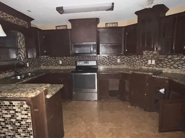 a view of a refrigerator with kitchen