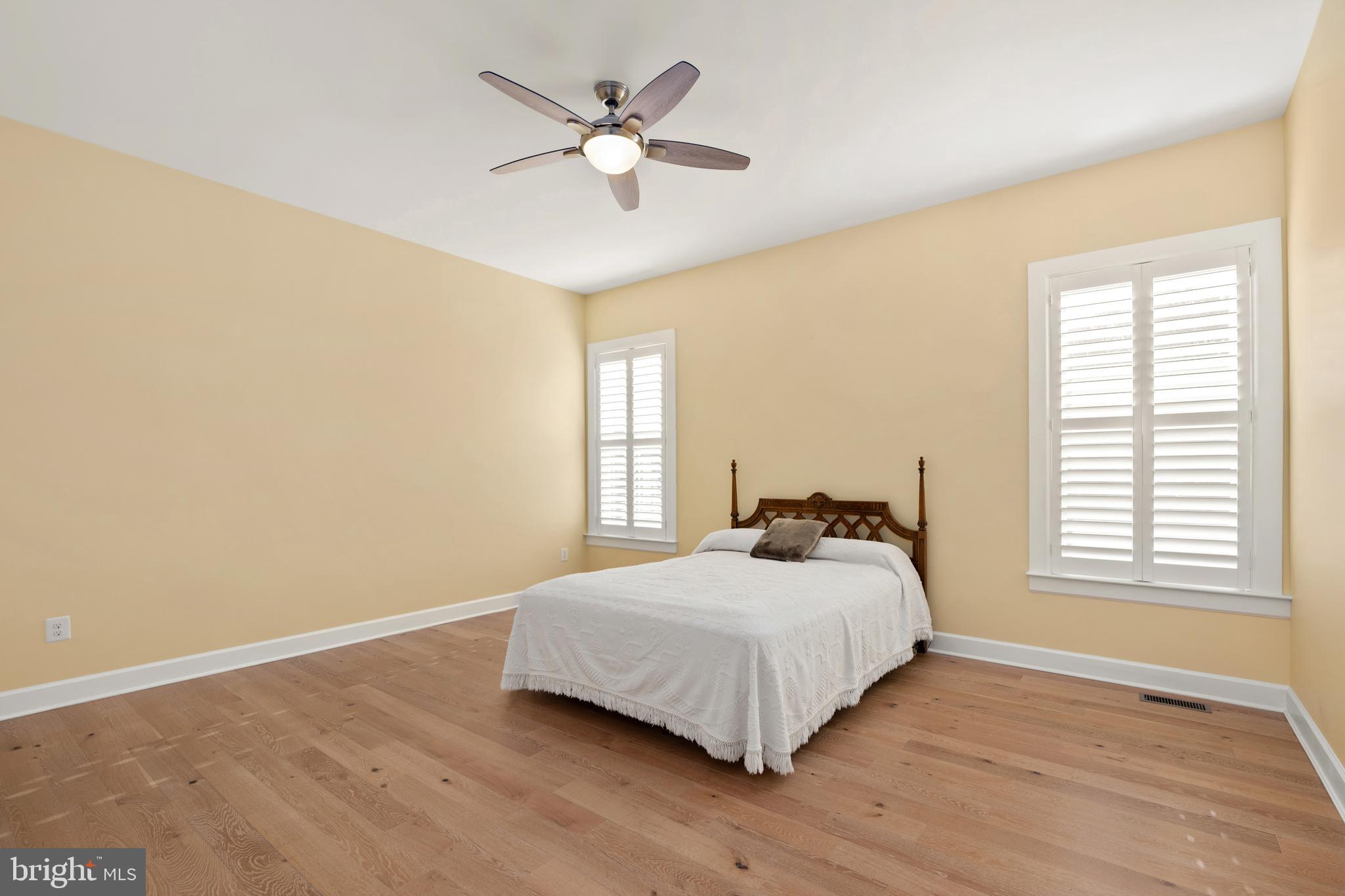 33415 Bridgehampton Lane Lewes, DE 19958 - Photo 15 of 66 a bedroom with a bed and a window