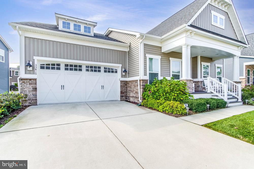 33415 Bridgehampton Lane Lewes, DE 19958 - Photo 2 of 66 a view of a house with a yard