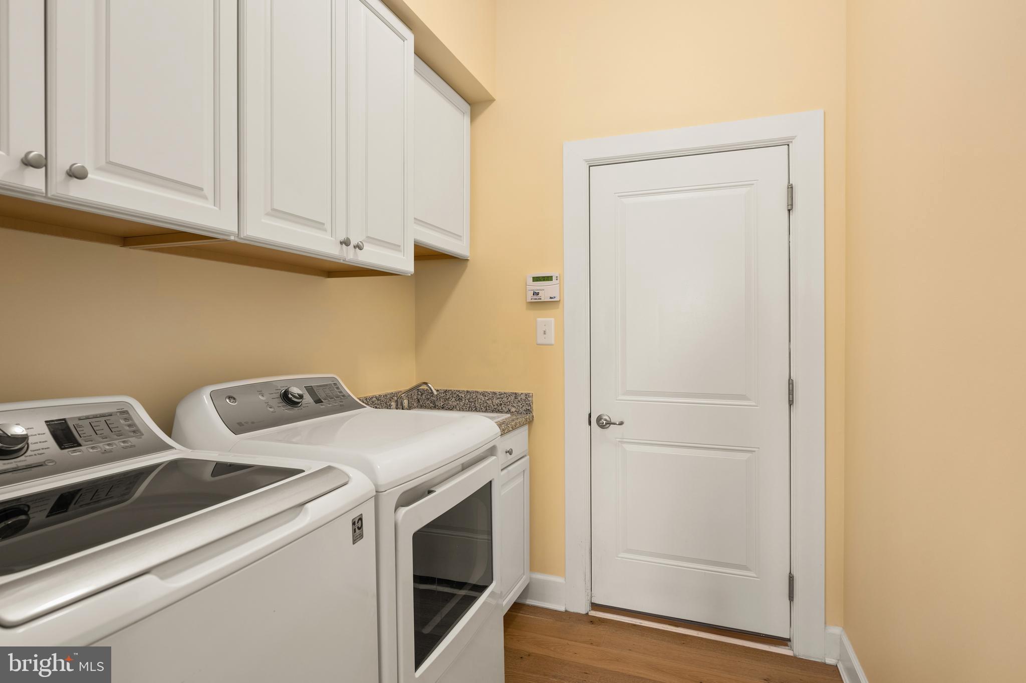 33415 Bridgehampton Lane Lewes, DE 19958 - Photo 26 of 66 a utility room with dryer and washer