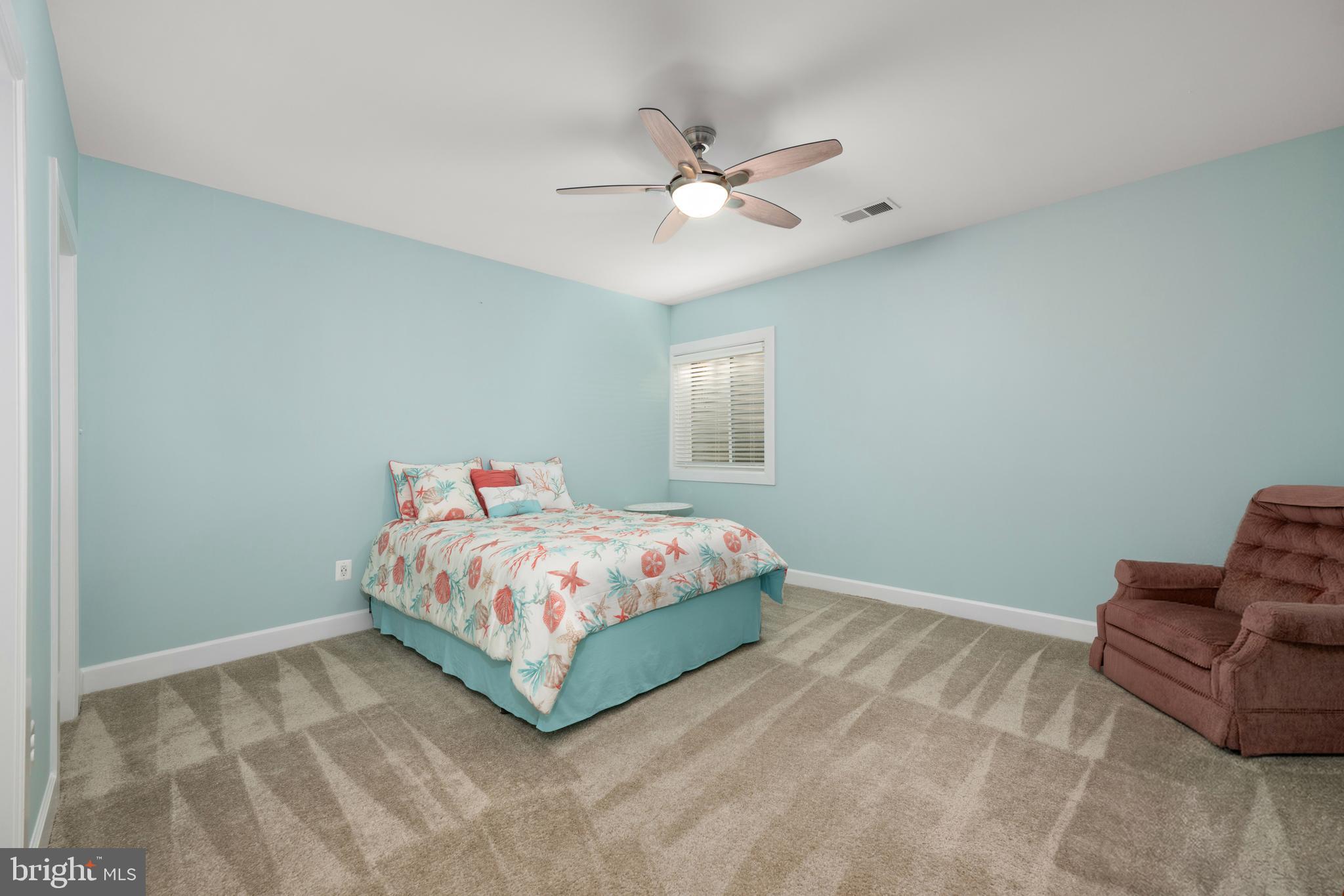33415 Bridgehampton Lane Lewes, DE 19958 - Photo 28 of 66 a bedroom with a bed and window