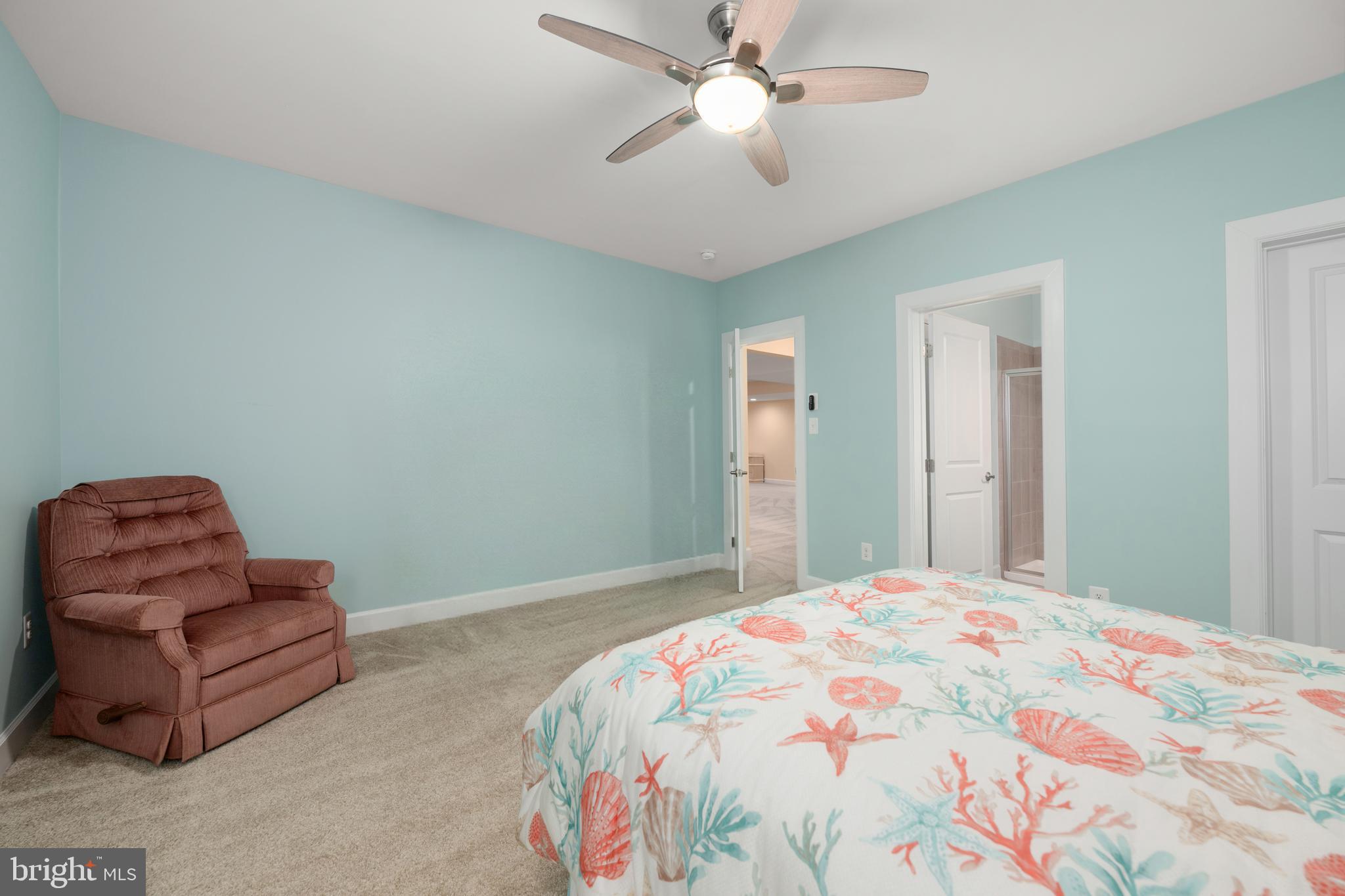 33415 Bridgehampton Lane Lewes, DE 19958 - Photo 29 of 66 a bedroom with a bed rug and couch