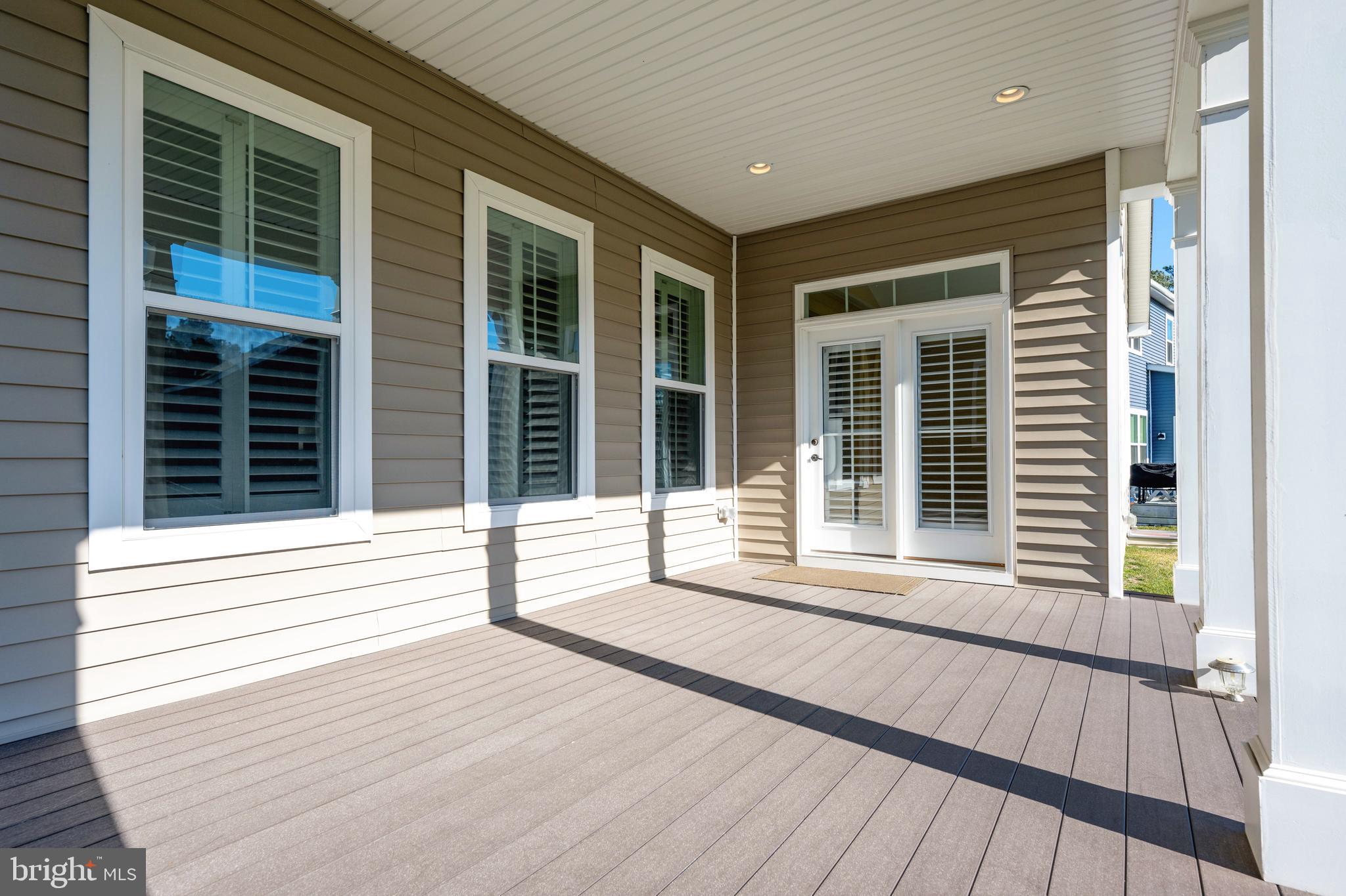 33415 Bridgehampton Lane Lewes, DE 19958 - Photo 35 of 66 a view of a house with a large window