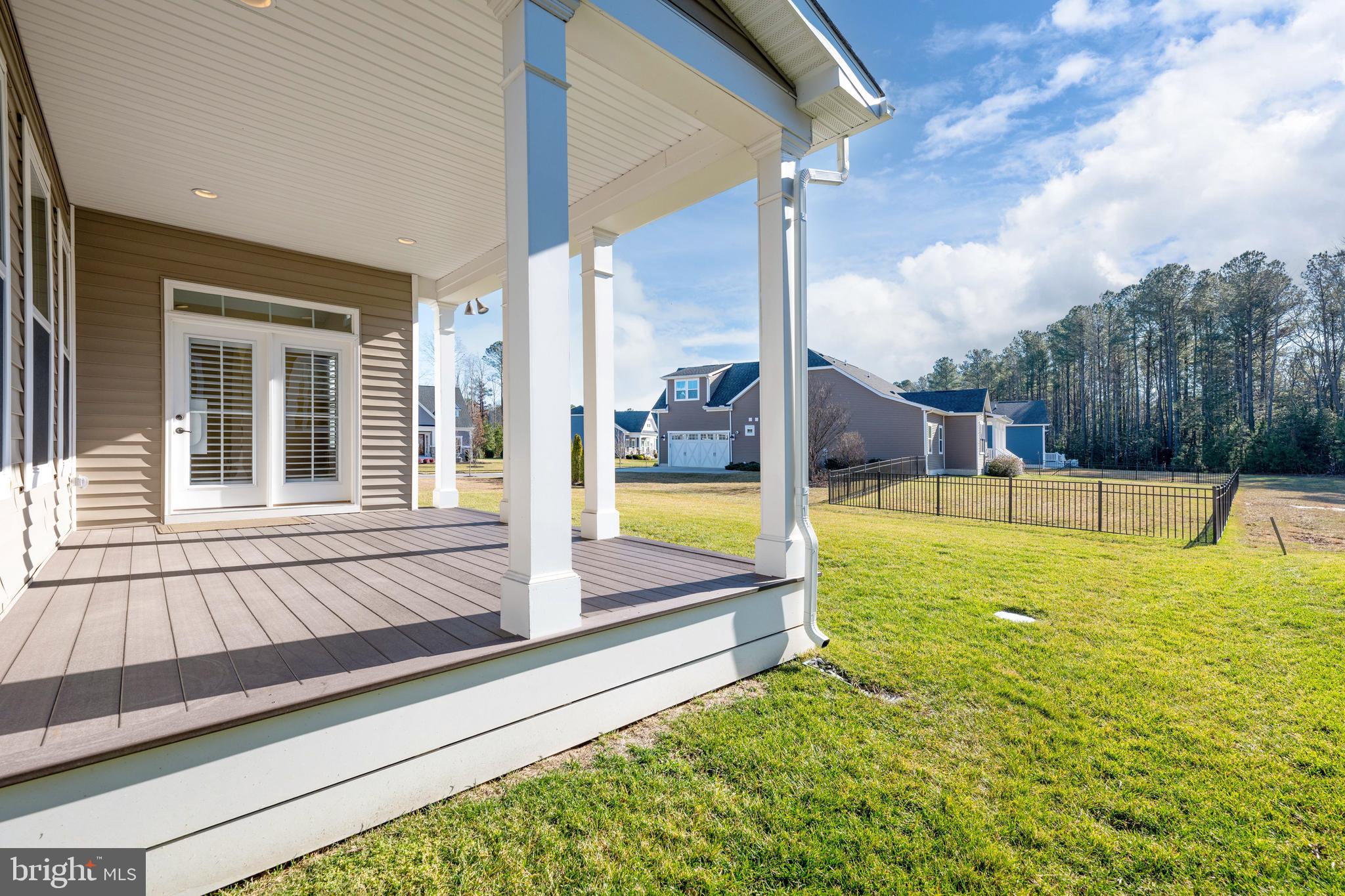 33415 Bridgehampton Lane Lewes, DE 19958 - Photo 37 of 66 a view of a house with swimming pool and sitting area