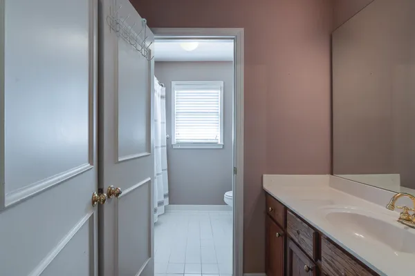 a bathroom with a sink and mirror