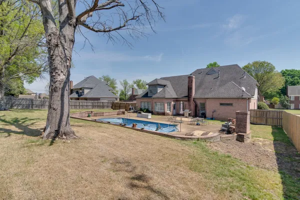 a view of house with outdoor space and sitting area