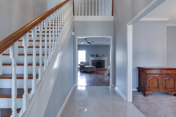 a view of a hallway view with staircase