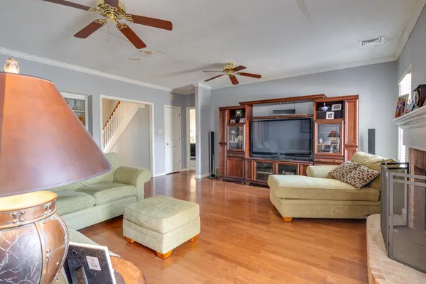 a living room with furniture and a flat screen tv