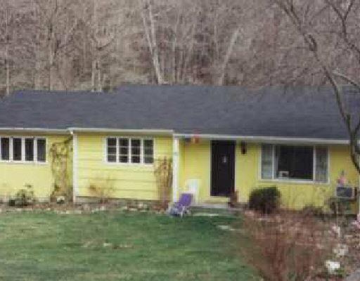 22 Olmstead Road Redding, CT 06896 - Photo 1 of 1 a front view of a house with a yard