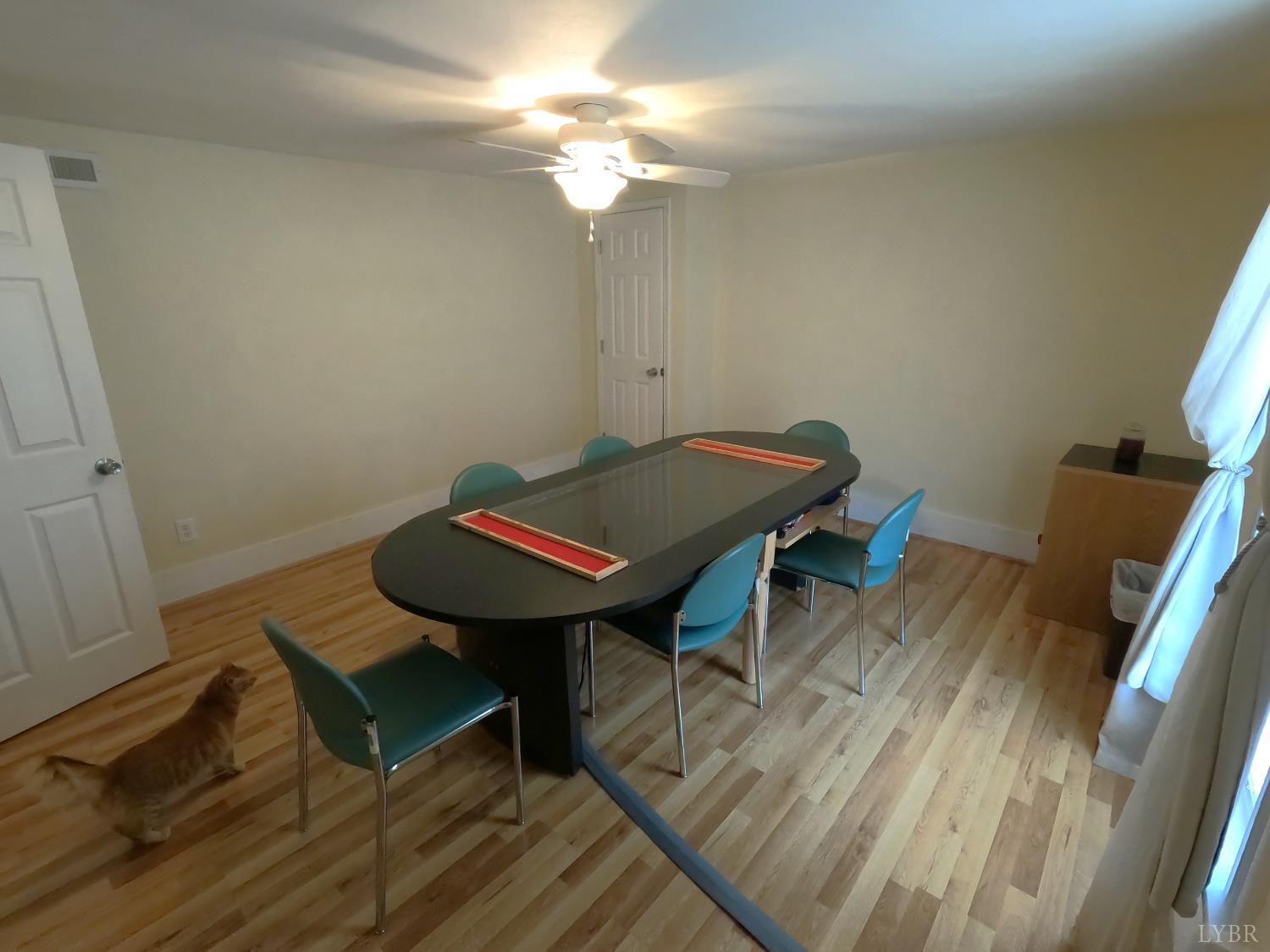 932 Bedford Road Vinton, VA 24179 - Photo 5 of 12 a view of a workspace with furniture and wooden floor