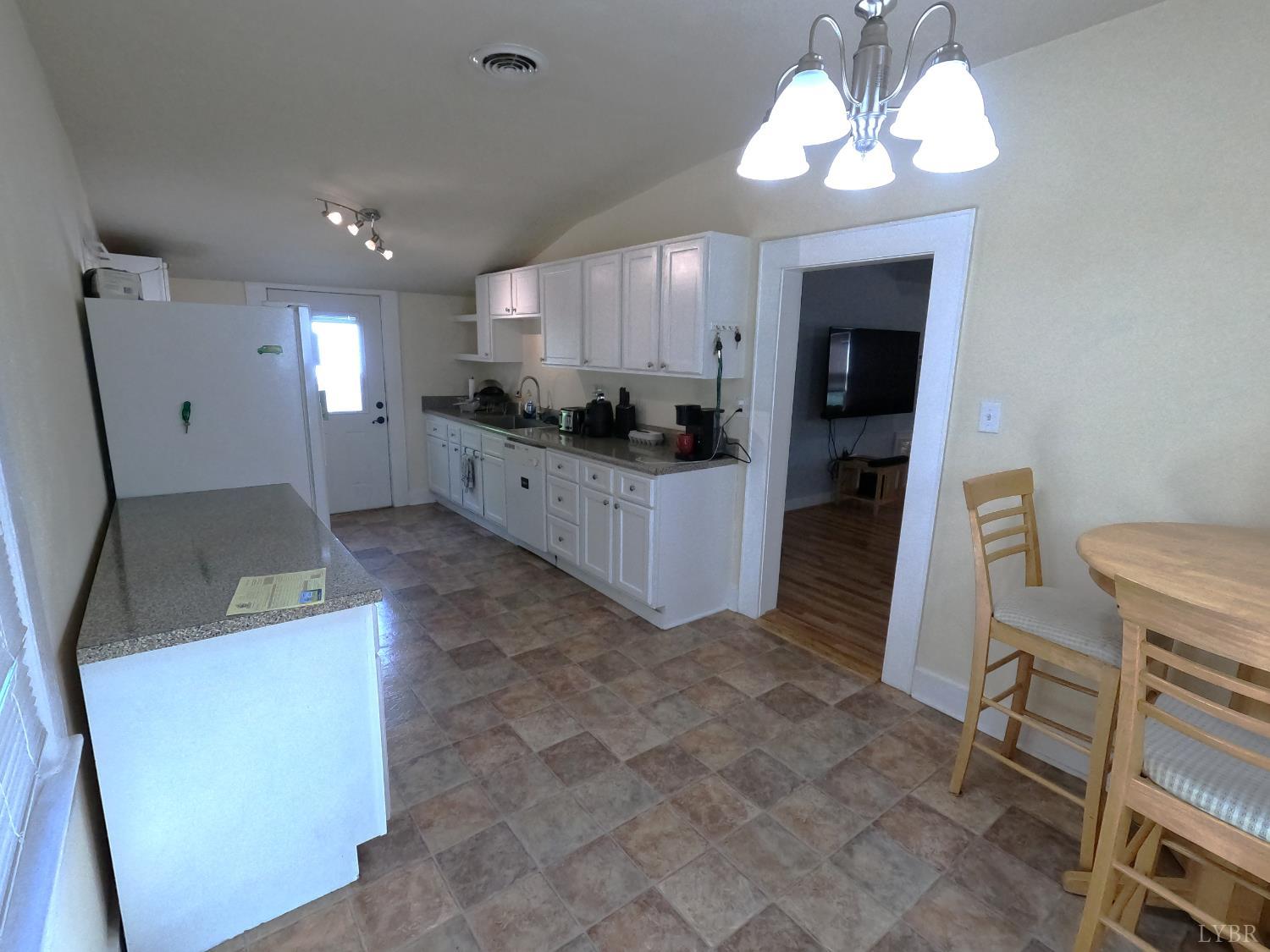 932 Bedford Road Vinton, VA 24179 - Photo 6 of 12 a large kitchen with a table and chairs