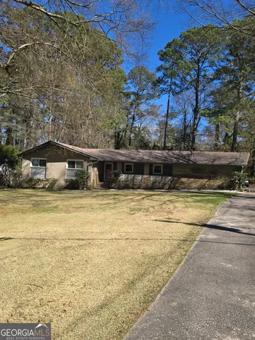 a view of swimming pool with seating area