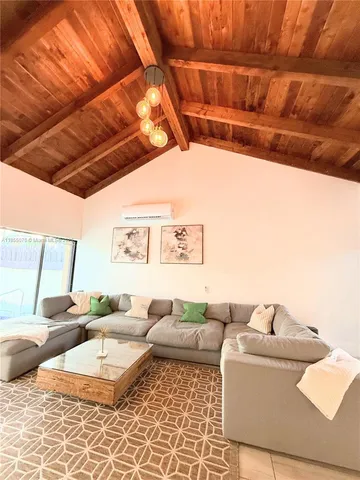 a living room with furniture and a rug