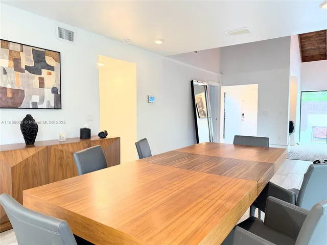 a room with two beds and a table