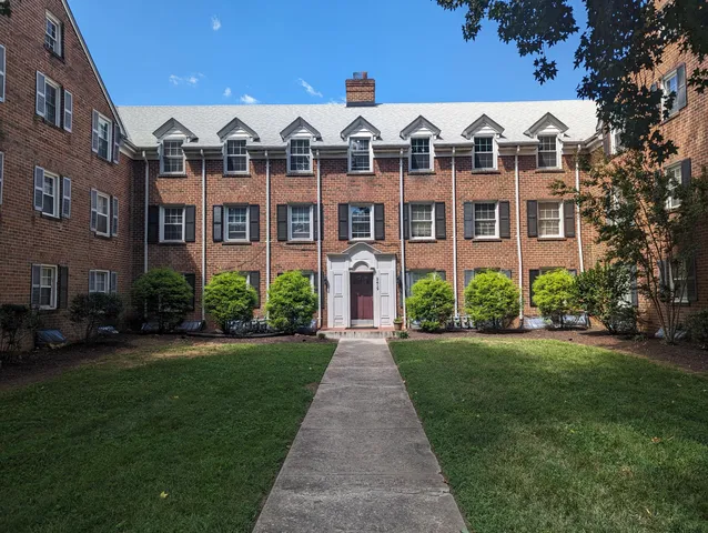 a front view of a building with garden
