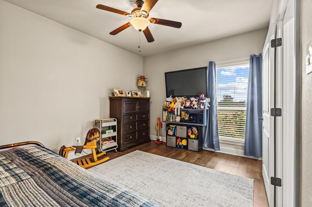 293 Redden Road Van Alstyne, TX 75495 - Photo 19 of 40 a bedroom with furniture and a window