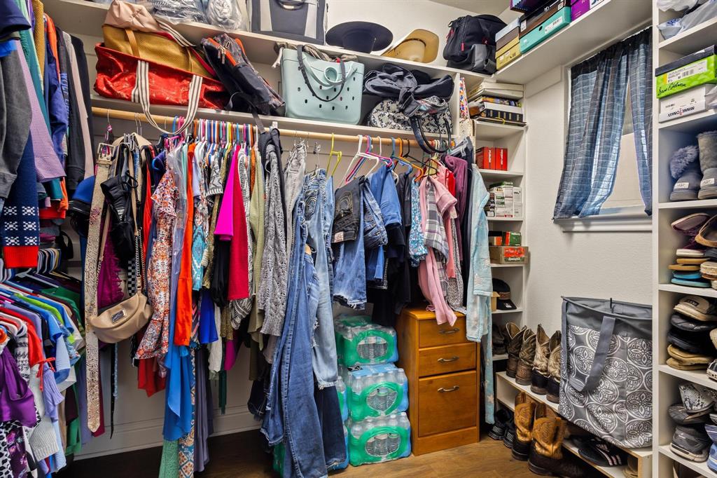 293 Redden Road Van Alstyne, TX 75495 - Photo 26 of 40 a view of walk in closet with clothes
